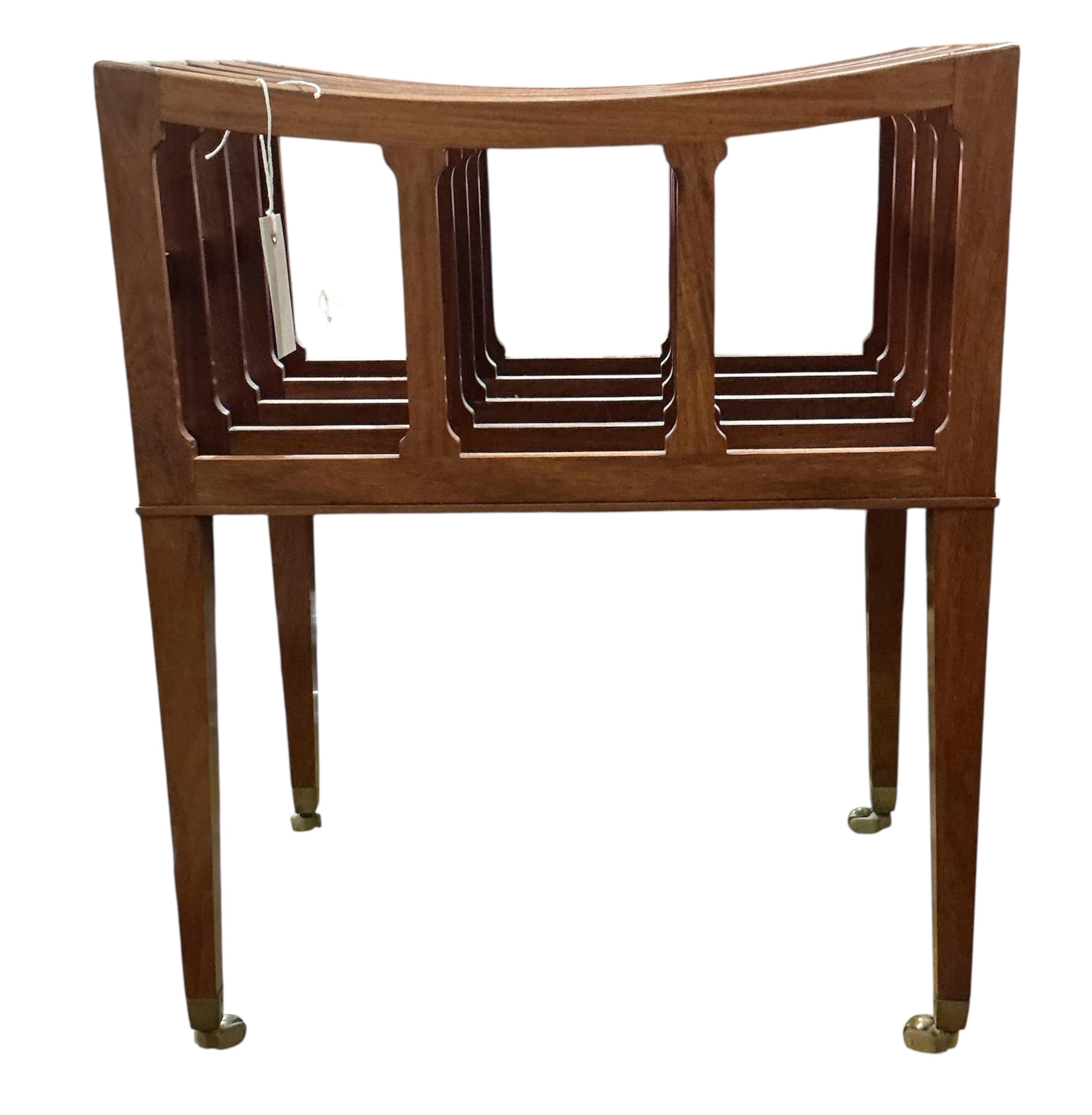 A reproduction mahogany four division Canterbury, width 45cm, depth 31cm, height 56cm